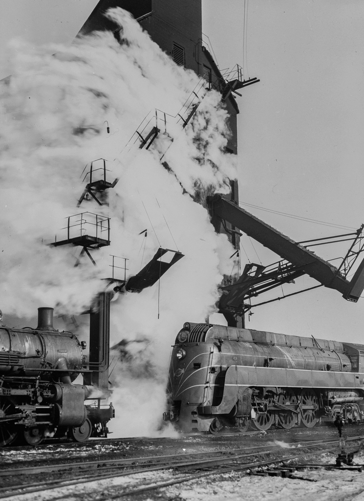 Chicago, Illinois. One of the Chicago and Northwestern Railroad's '400' fleet of locomotives lined up for coal and water at a coaling station