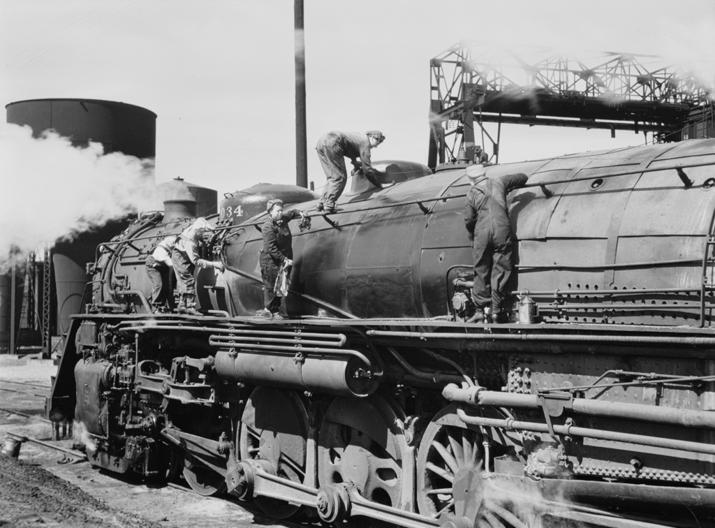 Clinton, Iowa. Women wipers of the Chicago and Northwestern railroad cleaning one of the giant locomotives