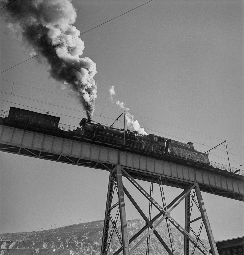 Bingham Canyon, Utah. Ore trains on a trestle bridge above an open-pit mine of the Utah Copper Company-Edit