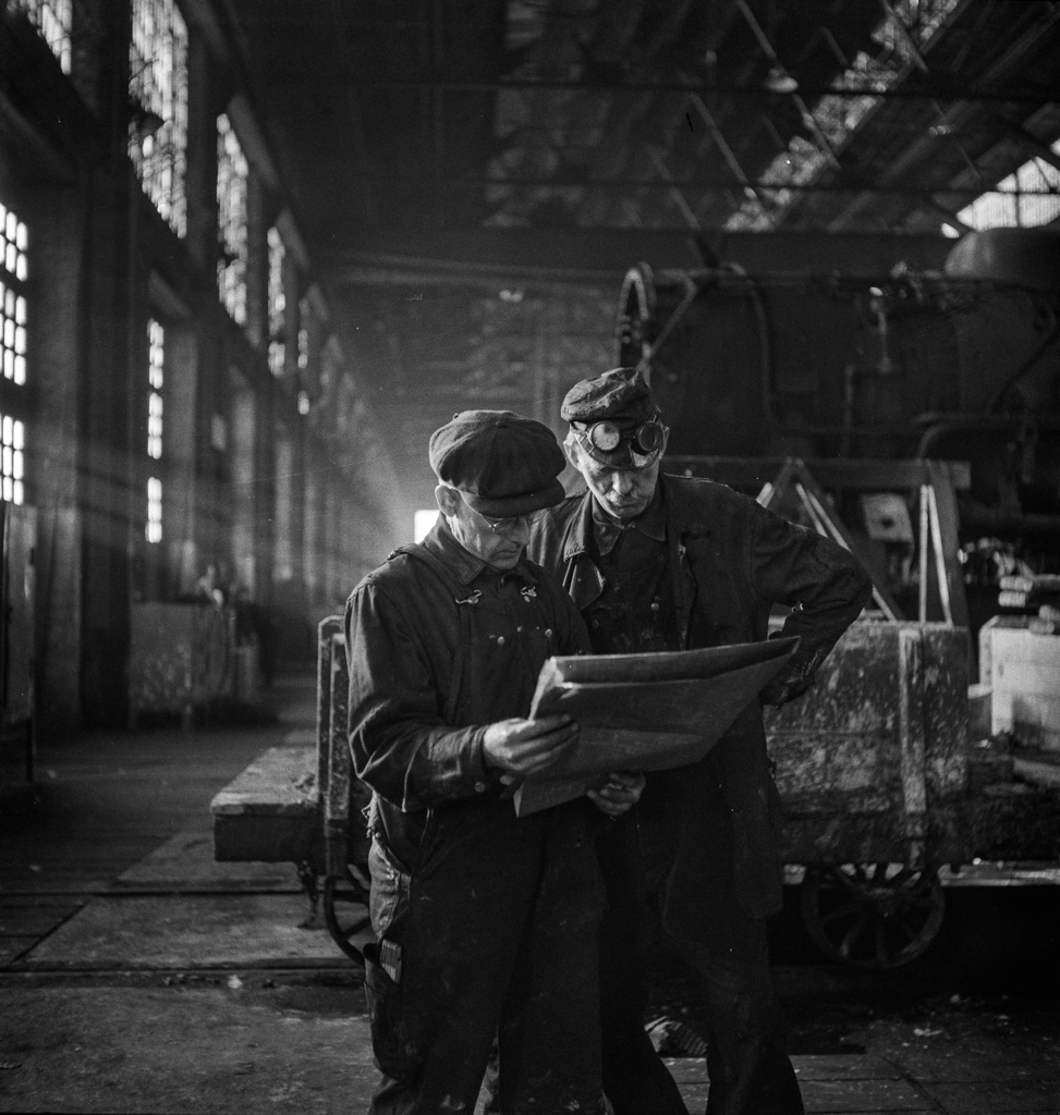 Chicago, Illinois. Workmen studying blueprints in the Chicago and Northwestern repair shops