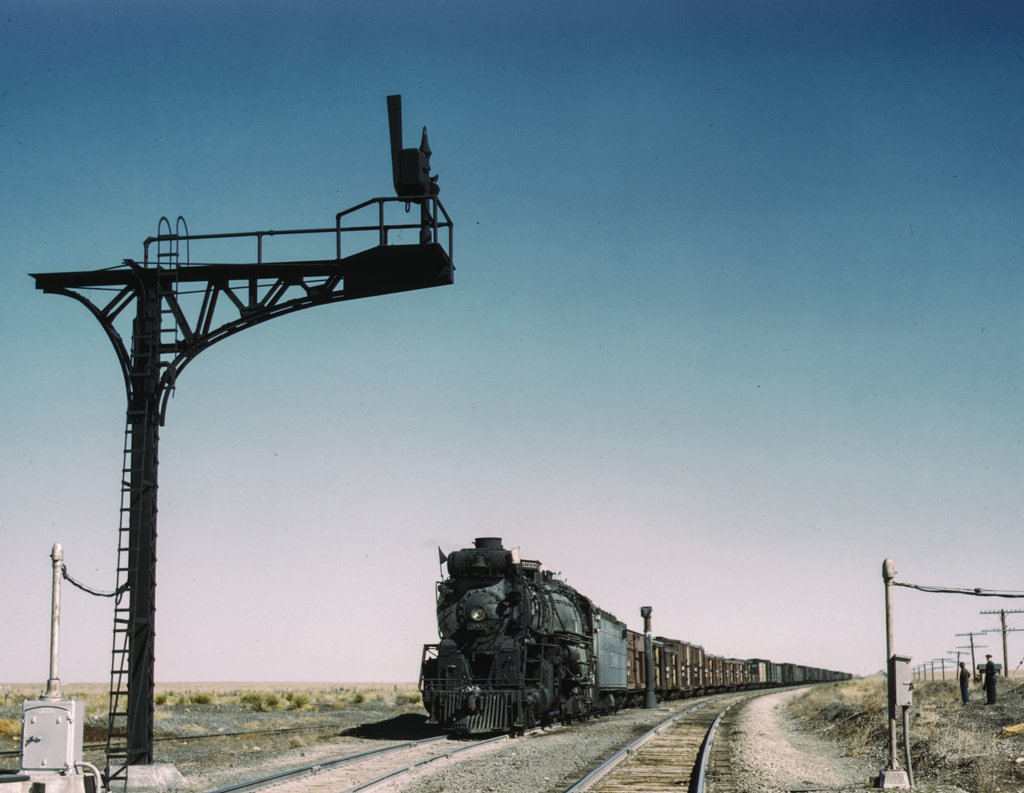 West bound Santa Fe R.R. freight train waiting in a siding to meet an east bound train, Ricardo, New Mexico