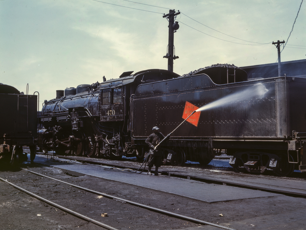 Cleaning an engine near the roundhouse, C. M. St. P. & P. R.R., Bensenville, Il