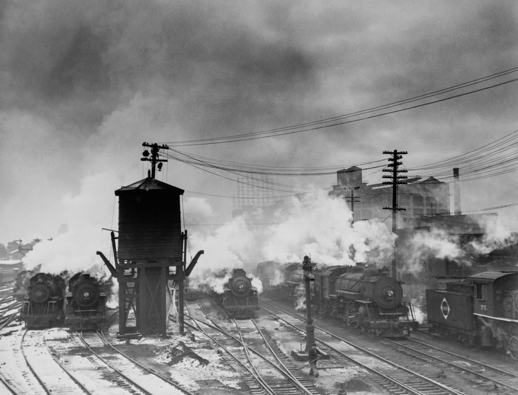 Locomotive and a watertower at the Erie Railroad yards, Jersey City, N.J-Edit